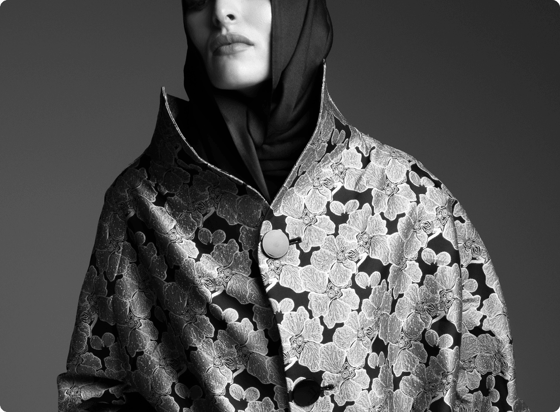 Model in patterned coat and hijab