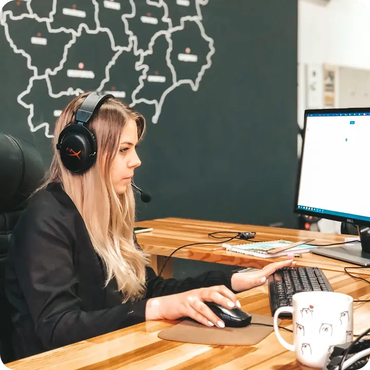 Woman working at computer desk