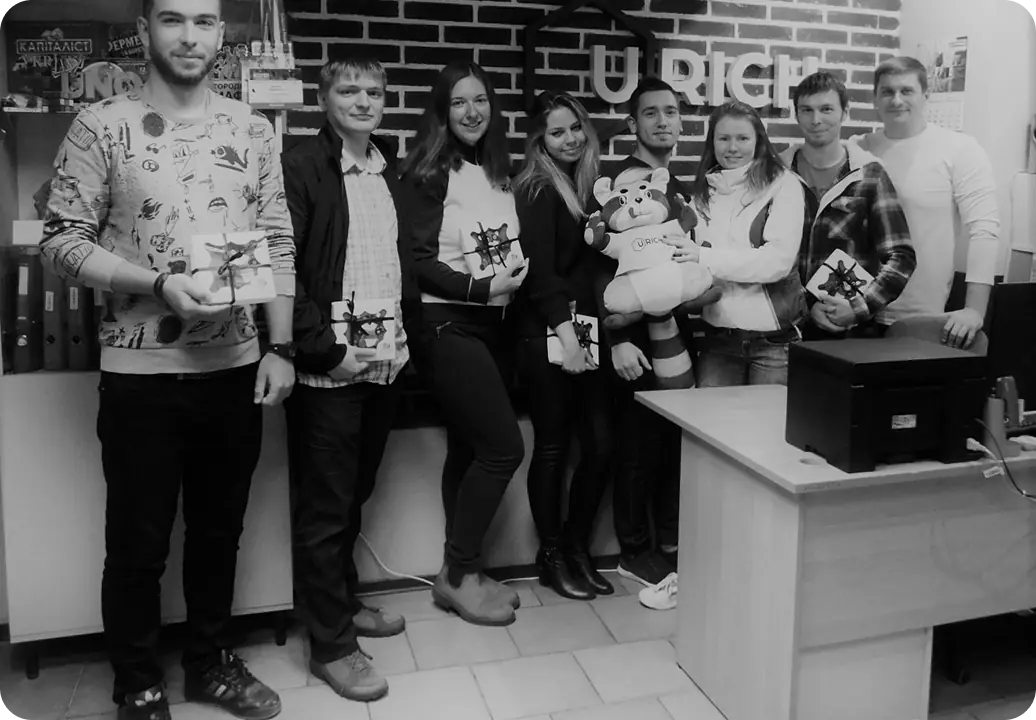 Group of people holding gifts